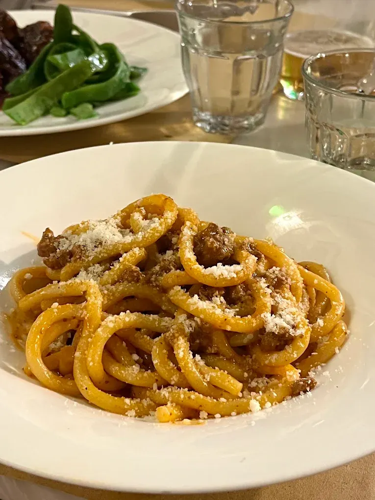 Pici al ragù con parmigiano